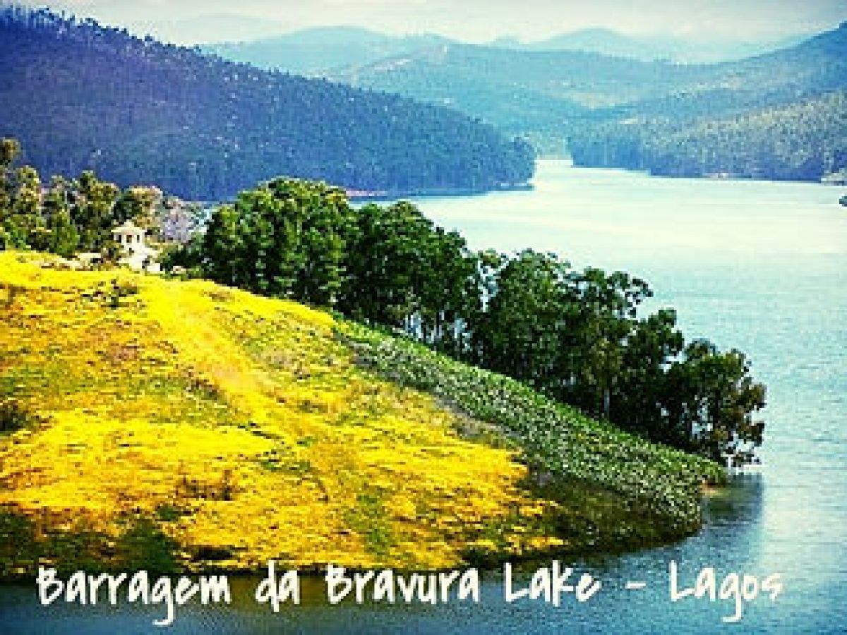 a body of water with a mountain in the background