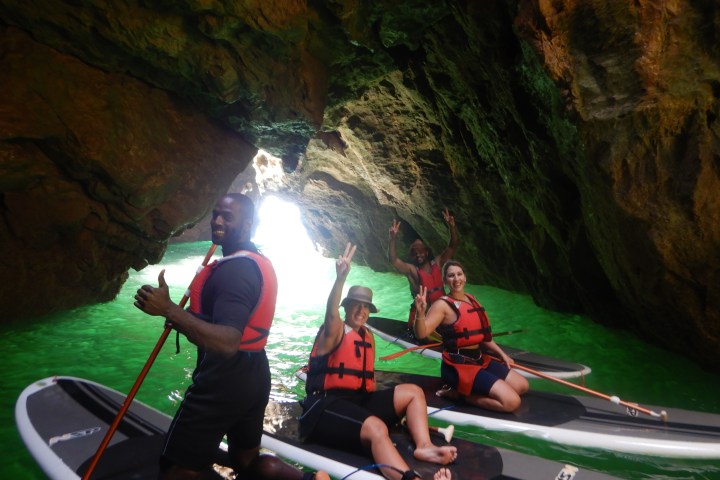 a group of people riding on the back of a boat