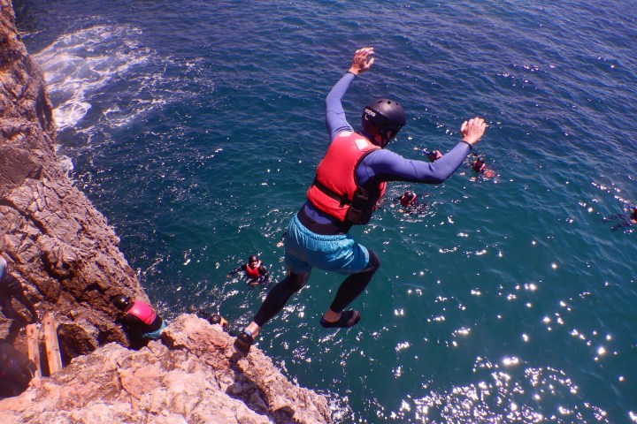 a person jumping into the water