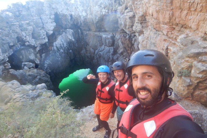 a man standing in front of a mountain