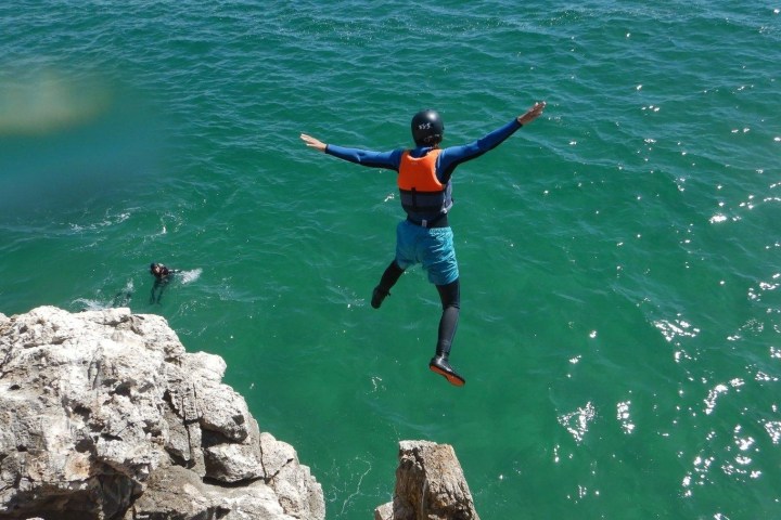 a man riding a surfboard in the water
