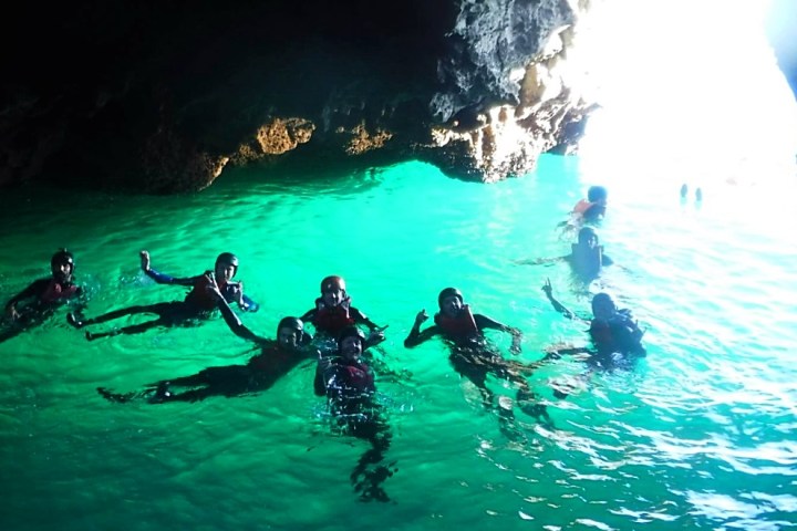 a group of people swimming in the water