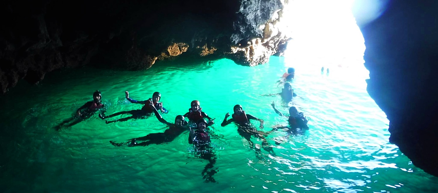 Coasteering Instructor Job a group of people swimming in the water