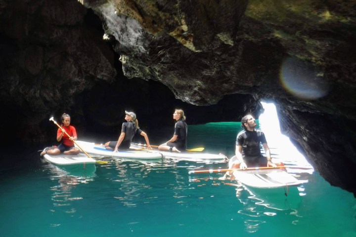 a group of people in a pool of water