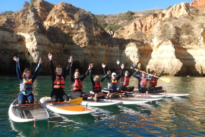 a group of people riding skis on top of a mountain