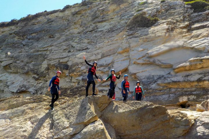a group of people on a rocky hill