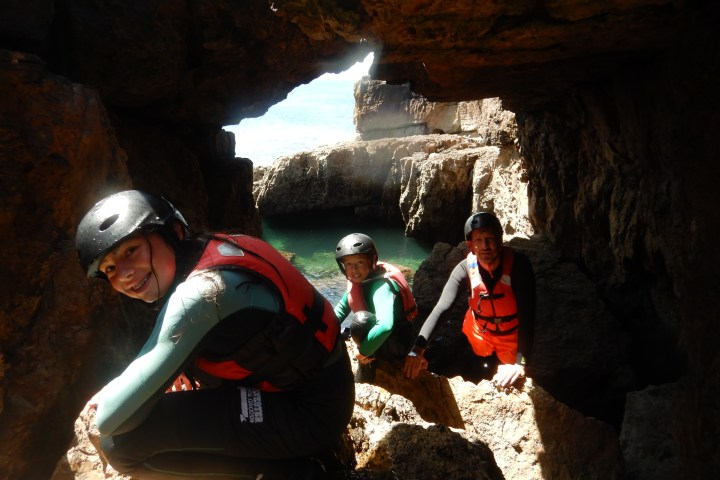 a group of people on a cave